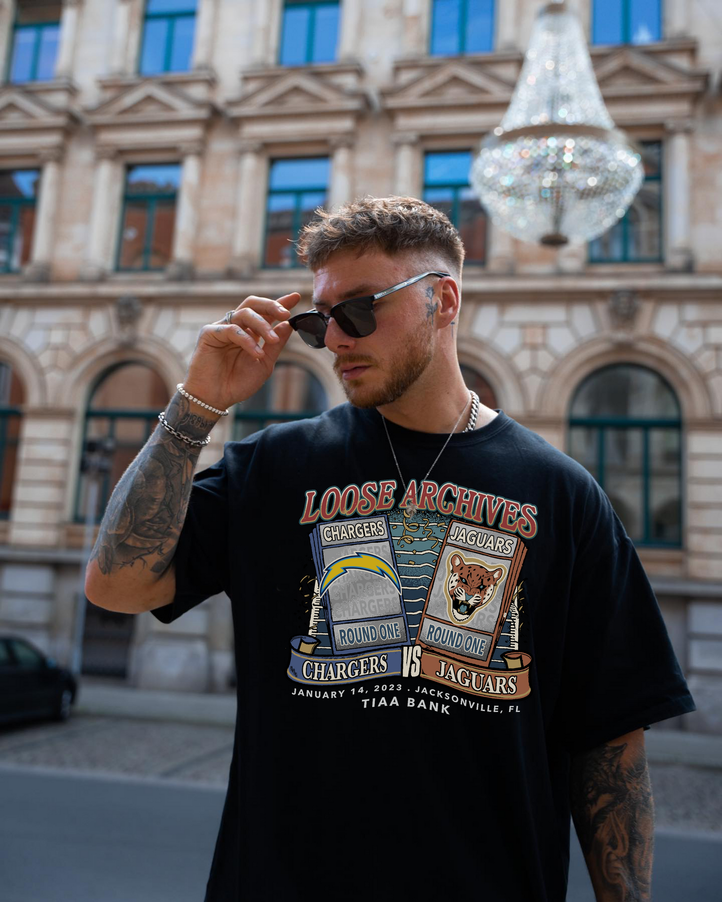 ROUND ONE TICKETS TEE IN BLACK