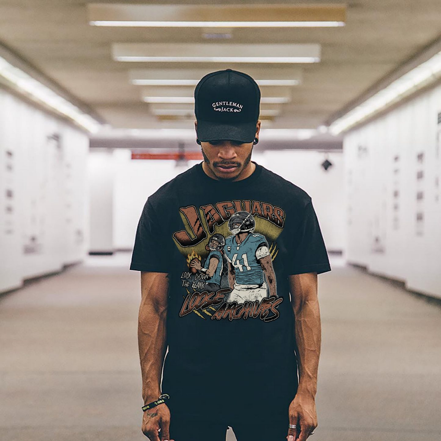 JAGUARS LOCK DOWN THE BANK TEE IN BLACK